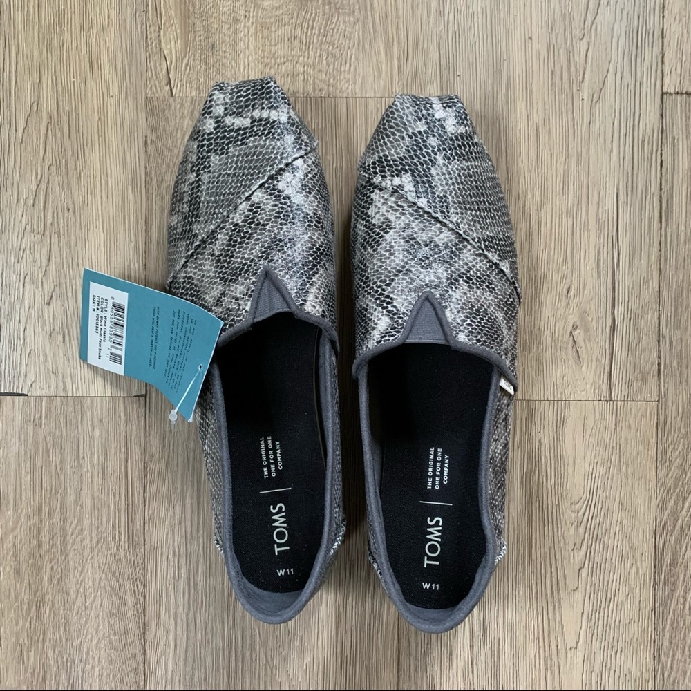Size 11 women’s Toms in scaly snakeskin, brand new